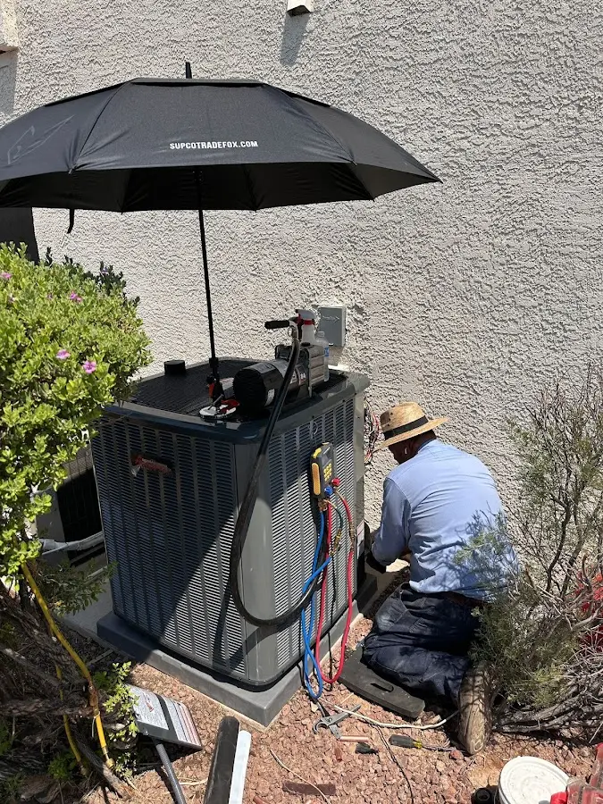HVAC technician performing outdoor AC maintenance in Roseville